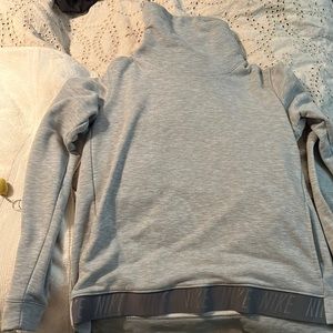 Cute Nike Sweatshirt with pockets and Nike logo across bottom